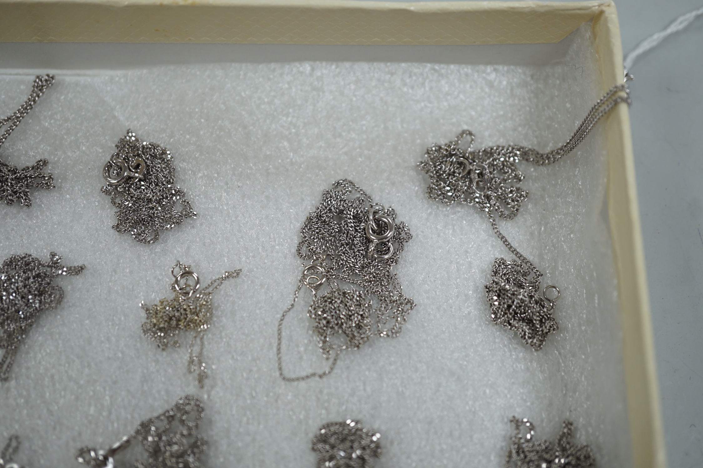 Thirteen assorted modern 375 white metal chains, longest 60cm, shortest 40cm, (one a.f.). 19.2 grams.